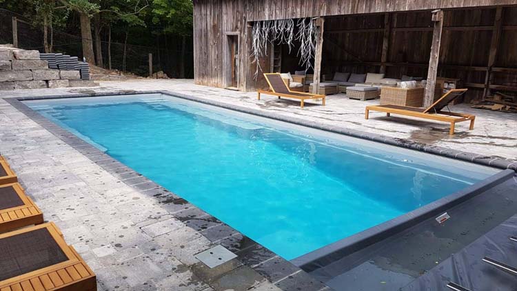 Mulmur Ontario Fiberglass Pool and Landscape Project Located 20 minutes outside the Orangeville area. The Infinity 40 foot Swimming Pool , Silver Grey 